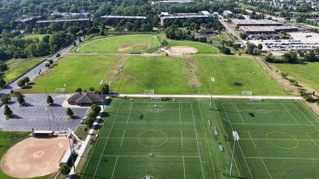 Aerial view of a sports field with soccer fields, baseball and softball fields in a suburban setting
