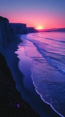 Stunning sunset over a serene beach, featuring gentle waves and vibrant purple hues in the sky.
