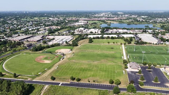 Aerial view of a sports field with soccer fields, baseball and softball fields in a suburban setting