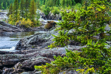 Lapland wilderness landscape showing flowing river and rocky terrain