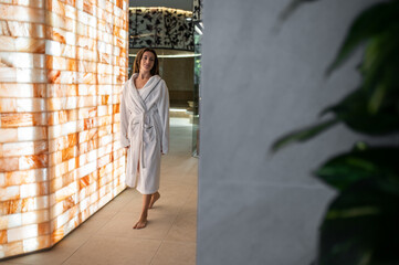 Long-haired pretty young woman in a spa center