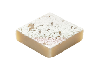 fudge square with cracked white topping close up on white background