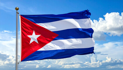 Cuban flag flying against a blue sky