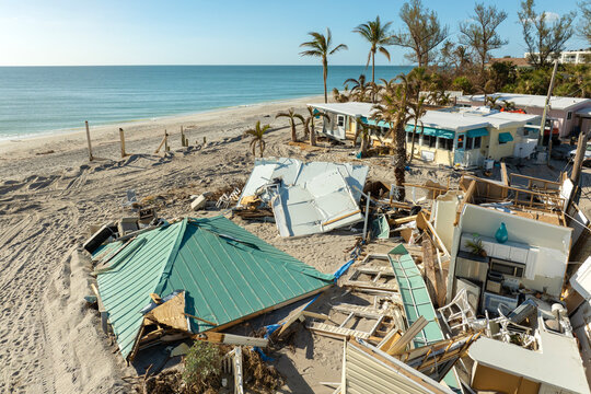Ruined buildings in need of demolition or repair. Storm surge water and wind damaged houses roof and collapsed walls after hurricane in Florida
