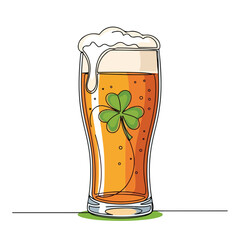Glass of beer with green shamrock for St Patrick's Day, showing frothy head, golden liquid. Festive beverage for St Patrick's Day celebrations, featuring Irish symbol, bubbles.