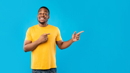 Look Aside. Black Male Pointing Fingers Showing Copy Space For Advertisement Text Standing Wearing...