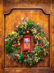 Christmas wreath and old wooden door