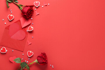 Composition with rose flowers, paper hearts and envelope on red background
