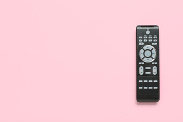 Modern TV remote control on pink background