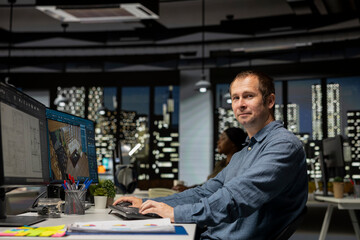 Professional worker in creative office uses CAD software and blueprints plan, designing a house interior with a user interface for virtual home customization. Detailed architectural layout.