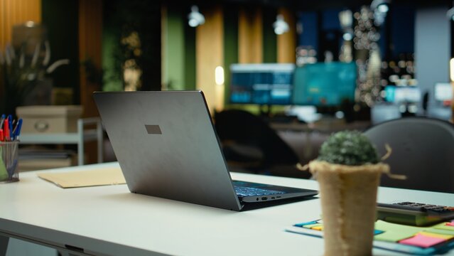 Professional empty office features computers and forecasting equipment. Modern space set for corporate planning, analytics and performance indicators that drive organizational success. - Powered by Adobe