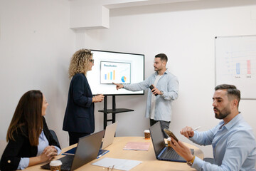 Business people discussing data analysis during a meeting