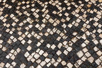Red Shoes on Vintage Black and White Stone Mosaic Pavement, Top View