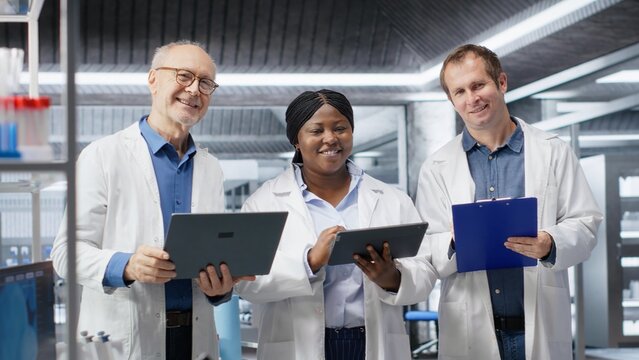 Portrait of diverse group of experts in the science lab conduct a research study, reflecting diagnostics and laboratory analysis. Staff advancing biochemistry and healthcare innovation. - Powered by Adobe