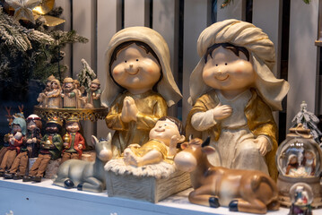 Festive christmas shop window with figurines and holiday decorations
