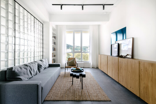 Modern Living Room With Large Windows and Minimalist Design