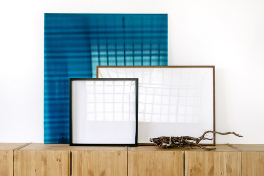 Different empty Frames template over Wooden Display