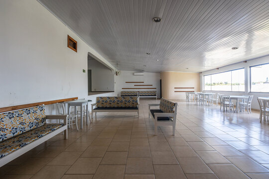 Common vintage hotel lounge area with sofas, tables, chairs and stage