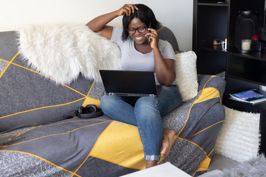 woman plus size talking on the mobile  phone and smiling at home