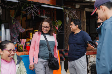 Happy tourists outside a street drinking establishment.