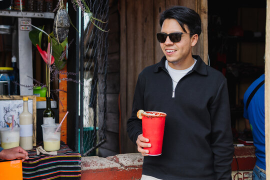 Man enjoying drinking a beer at pub