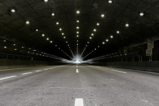Symmetrical Interior of Lit Tunnel