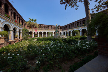 Fototapeta premium Silence and sunlight in the heart of Lima. The Convento de Santo Domingo offers a peaceful escape from the bustling city streets, where centuries of history are preserved in ever