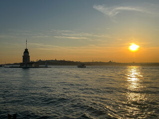 Sunset over the Maiden's Tower or Kiz Kulesi in the middle of the Bosphorus strait in Istanbul.