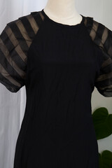 Black elegant dress on a mannequin