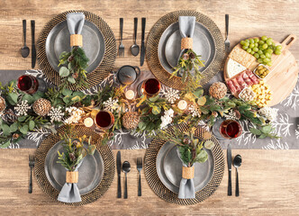 Beautiful table setting featuring an artificial eucalyptus fall garland with Pinecones and Berries,...