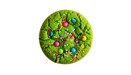 A vibrant, close-up shot of a round green cookie adorned with colorful candies and sprinkles