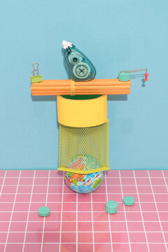 Globe with Stationery Objects on Colorful Background