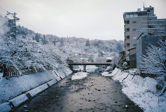 Old traditional Japanese houses under the blizzard in Takayama