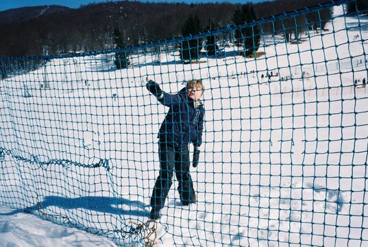 a kid in a snow resort