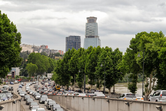 Busy Street with Traffic in Modern Urban District