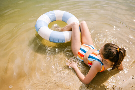 Relaxing on the beach with a colorful inflatable ring