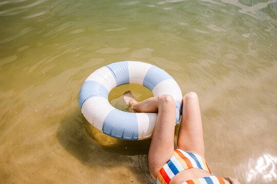 Relaxing on the beach with a colorful inflatable ring