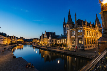 Evening Lights Illuminate Historic Buildings Along the River in Ghent