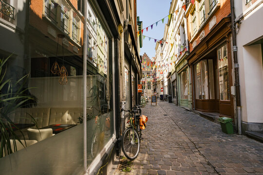 Charming Cobblestone Alley With Decorated Storefronts in a City