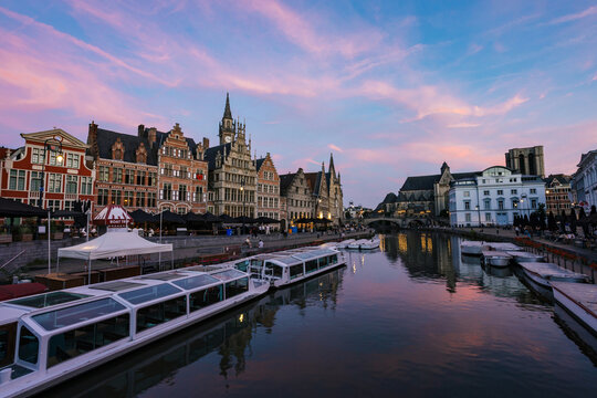 Evening Glow Over Historic Buildings and Boats in Ghent