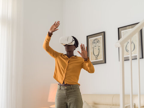 Woman enjoying VR video game 