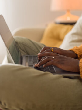 Woman typing on laptop keyboard 