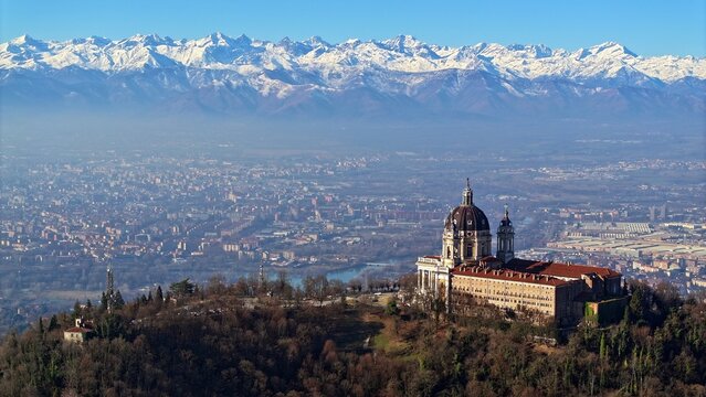 aerial view of the Basilica of Superga with the Turin skyline surrounded by the snow-capped Alps. Superga, Turin, Italy - Superga, Turin, Italy - January 6, 2026
