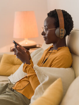 Woman arranging playlist on smartphone