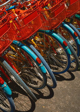 Colorful Bicycles Lined up Ready for Use in a Sunny Location