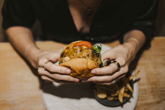 Hand Holding Smash Burger