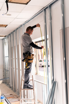 Man constructing drywall 