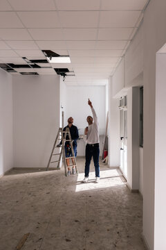 Foreman instructing his employee