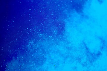 Abstract blue background with water and clouds. Aerial view illustration in white and blue. Illustration of a ground and sky background. Particles,  motion and galaxy.