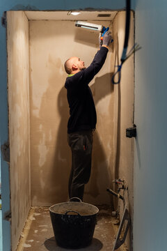 Worker applying hermetic seal 
